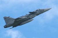 39249 @ ESKD - Saab Gripen slow speed fly-past, Dala-Järna airfield, Sweden. - by Henk van Capelle