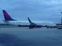 N392DA @ KLAF - waiting to take the Michigan football team home - by Brad