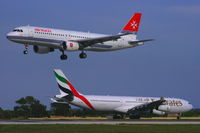 A6-ERQ @ LMML - A340 A6-ERQ of Emirates Airlines waiting to line up RW31 behind the landing Airmalta A320 9H-AEK. - by Raymond Zammit