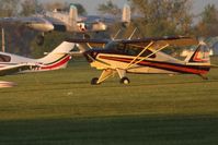 N2519P @ I74 - Dawn in the grass at Urbana.  B-25 N3155G departing in the background for the B-25 Gathering and Doolittle Reunion in Dayton. - by Bob Simmermon