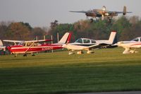N3680S @ I74 - In the grass at Urbana during the B-25 Gathering.  B-25 N3476G departing in the background.