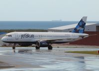 N566JB @ AUA - Taxi to the gate of Reina Beatrix Airport Aruba - by Willem Göebel