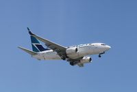 C-GYWJ @ KSNA - Boeing 737-700 - by Mark Pasqualino