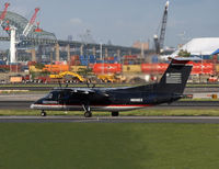 N806EX @ KEWR - Still wearing its old US Airways scheme, this Dash-8 taxies for takeoff at Newark. - by Daniel L. Berek