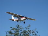 N704JH @ SZP - 1976 Cessna 150M, Continental O-200 100 Hp, on final Rwy 04 over the airport's western boundary. Full flap landing. - by Doug Robertson