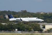N999EK @ KSAT - A little high over 12R - by RWB