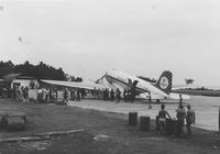 JZ-PDC @ KNG - At the platform of Kaimana-strip in previous Netherlands New Guinea, arriving from Biak with amongst others the mail for the Dutch soldiers

1962 - by Antoni P. Uni