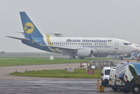 UR-GAT @ EGSH - Being towed in the fog to the Air Livery hangar.