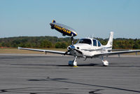 N530ET @ KDAN - Cirrus SR22 in Danville Va. as the Goodyear steers down toward it's mooring . - by Richard T Davis