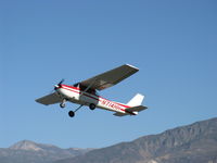 N714HH @ SZP - 1977 Cessna 150M, Continental O-200 100 Hp, takeoff climb Rwy 22. Hines Peak at 6,704' lower left. - by Doug Robertson