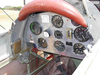 VH-ART @ YRBE - A look at the interior. Some basic flight references on the dashboard.