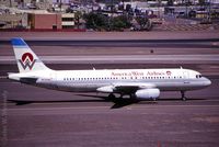 N639AW @ KPHX - March 1999 - in the penalty box at PHX, waiting for a gate. - by John Meneely