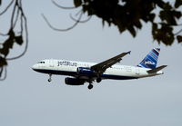 N657JB @ KLAS - Taken on final approach to McCarran International Airport.