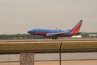 N276WN @ RSW - RWY 6 on  a cloudy day - by Mauricio Morro