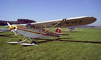 HB-PHZ @ LSZK - Piper PA-18-150 Super Cub [18-8009039] Speck~HB 03/10/1986. Image taken from a slide. - by Ray Barber