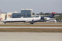 N912FJ @ KSRQ - US Air Flight 2687 operated by Mesa (N912FJ) departs Sarasota-Bradenton International Airport enroute to Charlotte-Douglas International Airport - by Jim Donten