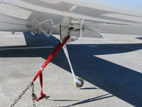 N211KA @ SZP - 2003 Klinefelter EUROPA XS, Rotax 914UL turbocharged 113.4 Hp, closeup of near mid-span outrigger wheel-they go up or down with the flaps-so every landing should be a flap landing-hopefully. - by Doug Robertson