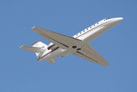 N323QS @ KSRQ - Execjet Flight 323 (N323QS) departs Sarasota-Bradenton International Airport enroute to Houston-Hobby International Airport - by Jim Donten