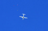 G-SYLV @ EGFH - 1st lift of the day, 12500', if you click on the photo you can see 3 parachutists exiting the ac. - by Derek Flewin
