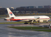 9M-MRB @ AMS - Taxi to the gate of Schiphol Airport - by Willem Göebel