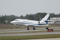 N909MM @ KSRQ - Dassualt Falcon 2000EX (N909MM) departs Sarasota-Bradenton International Airport - by Jim Donten