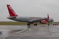 G-LSAC @ EGSH - Being towed to the Air Livery hangar in very dull and wet conditions.