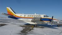 N125DP @ KAXN - A Beech 99 of Bemidji Aviation Services resting between cargo runs during the holiday season. - by Kreg Anderson