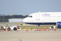 N706JB @ KSRQ - Jet Blue Airbus A320 (N706JB) prepares for flight at Sarasota-Bradenton International Airport - by Jim Donten