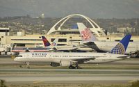 N558UA @ KLAX - Taxiing to gate - by Todd Royer