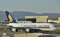 9V-SKE @ KLAX - Taxiing for departure - by Todd Royer