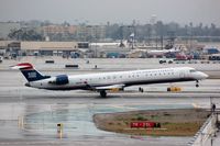 N912FJ @ KLAX - US Express CL900 landing at LAX - by FerryPNL