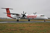 VT-SUJ @ EGHH - ex C-GLFS taxiing to depart on delivery. - by John Coates