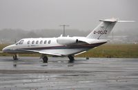 G-OCJZ @ EGHH - In pouring rain at Citation Centre - by John Coates