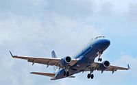 N858RW @ KATL - An Embraer ERJ 170 on short final RWY 27R@ATL. (An f-Stop 5.6 Photo) - by Bill Thornton