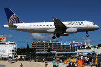 N411UA @ SXM - Over famous Maho Beach - by Wolfgang Zilske