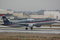 N174US @ KLAX - US A321 landing in wet LAX - by FerryPNL