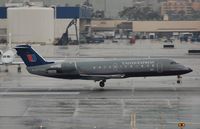 N970SW @ KLAX - UA Express CL200 landing - by FerryPNL
