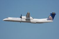 N214WQ @ KEWR - CO Express Dash8 taking off - by FerryPNL