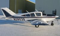 N28039 @ KAXN - Bellanca 17-30A Super Viking in front of the hangars on Christmas Eve.
