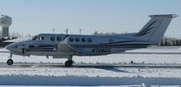 N708DC @ KAXN - Raytheon B300 Super King Air taxiing to runway 31 for departure on Christmas Eve. - by Kreg Anderson