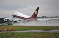 VP-BAT @ EGHH - Wet departure to La Suisse - by John Coates