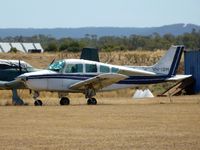 VH-ISM @ YMEL - This Beech Sierra is seen through the heat haze, parked at Melton airfield. - by red750
