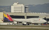 HL7418 @ KLAX - Taxiing for departure - by Todd Royer
