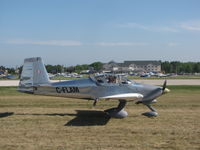 C-FLAM @ KOSH - taxing at Oshkosh - by steveowen