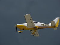 N86ND @ KOSH - heading into a stormy sky - by steveowen