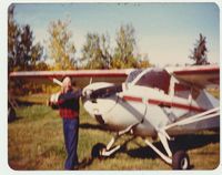CF-OML - A fuzzy pic of Walt Pudar with his plane on his own farm airstrip in Sangudo Alberta. I took this picture in 1983. - by Mark Thompson