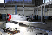 N96224 @ TIP - next to a P-51H - by olivier Cortot