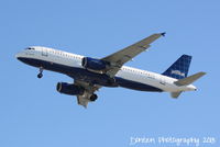 N556JB @ KSRQ - JetBlue Flight 341 Betty Blue (N556JB) on approach to Runway 32 at Sarasota-Bradenton International Airport following a flight from John F Kennedy International Airport - by Donten Photography