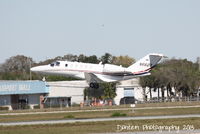 N660S @ KSRQ - Cessna CitationJet 2 (N660S) departs Runway 32 at Sarasota-Bradenton International Airport - by Donten Photography
