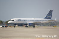 N709JB @ KSRQ - JetBlue Flight 1188 Brand Spankin' Blue (N709JB) prepares for flight at Sarasota-Bradenton International Airport - by Donten Photography